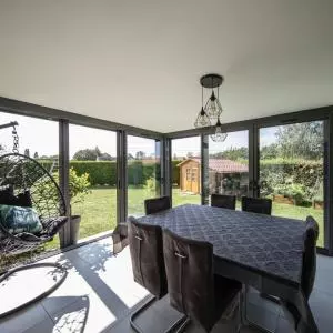 une superbe extension de sa maison avec une veranda lumineuse