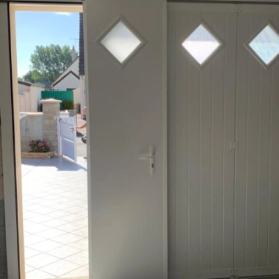 Pose d'une porte de garage sectionnelle by Fame